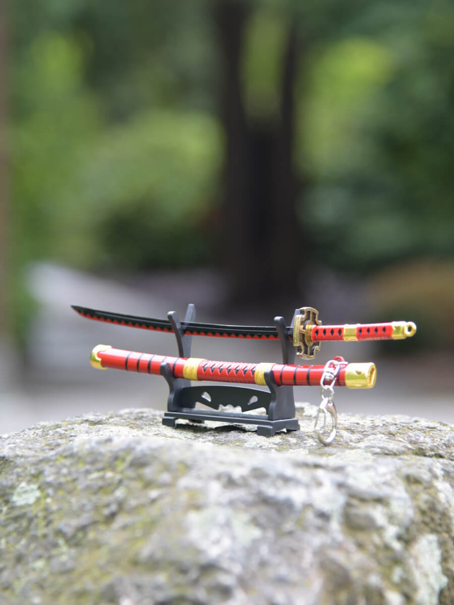 Slight side view focusing on the handle of Kitetsu miniature katana on its stand - One Piece.