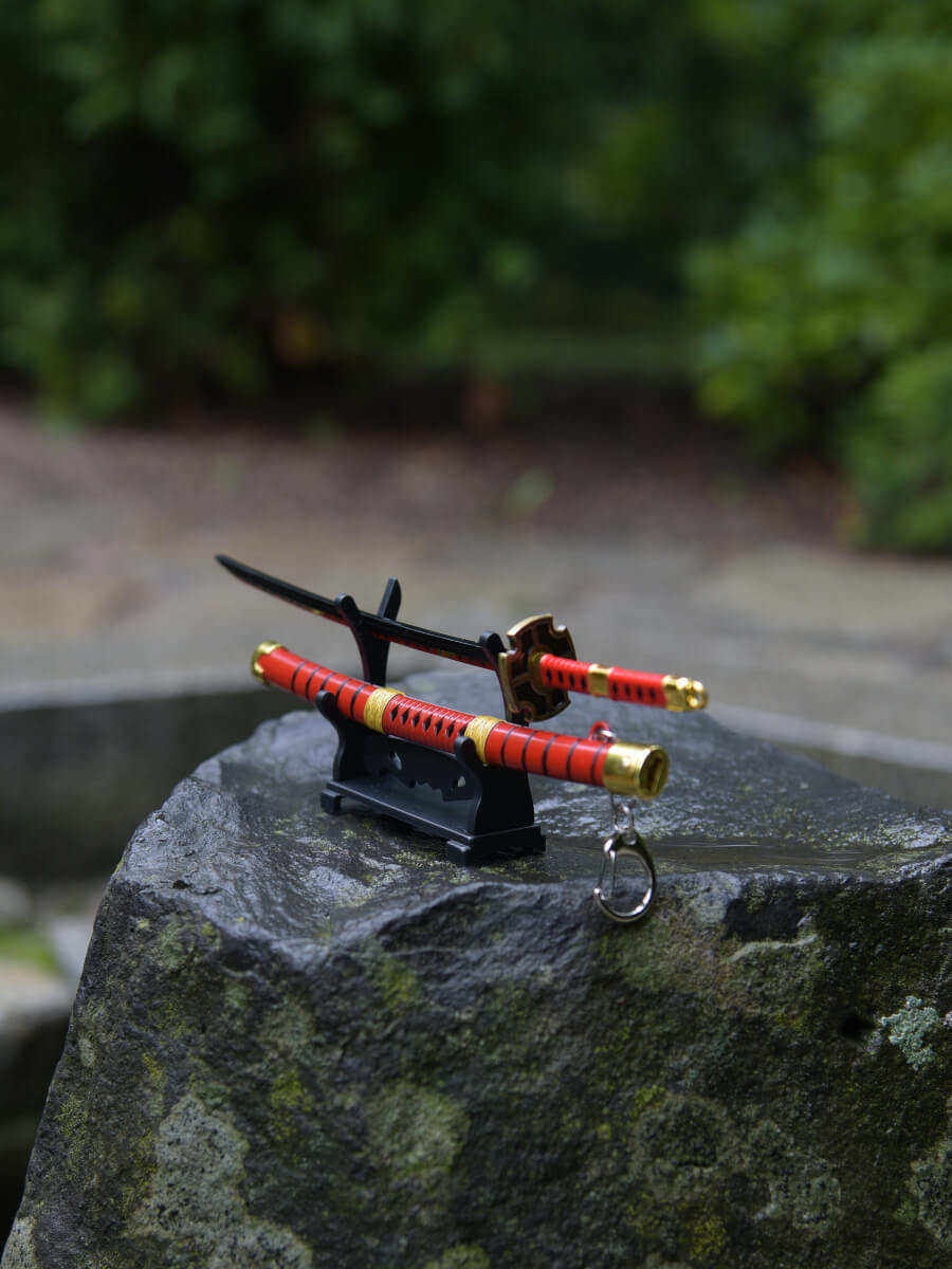 Angled top view of Kitetsu miniature katana handle on its stand - One Piece.