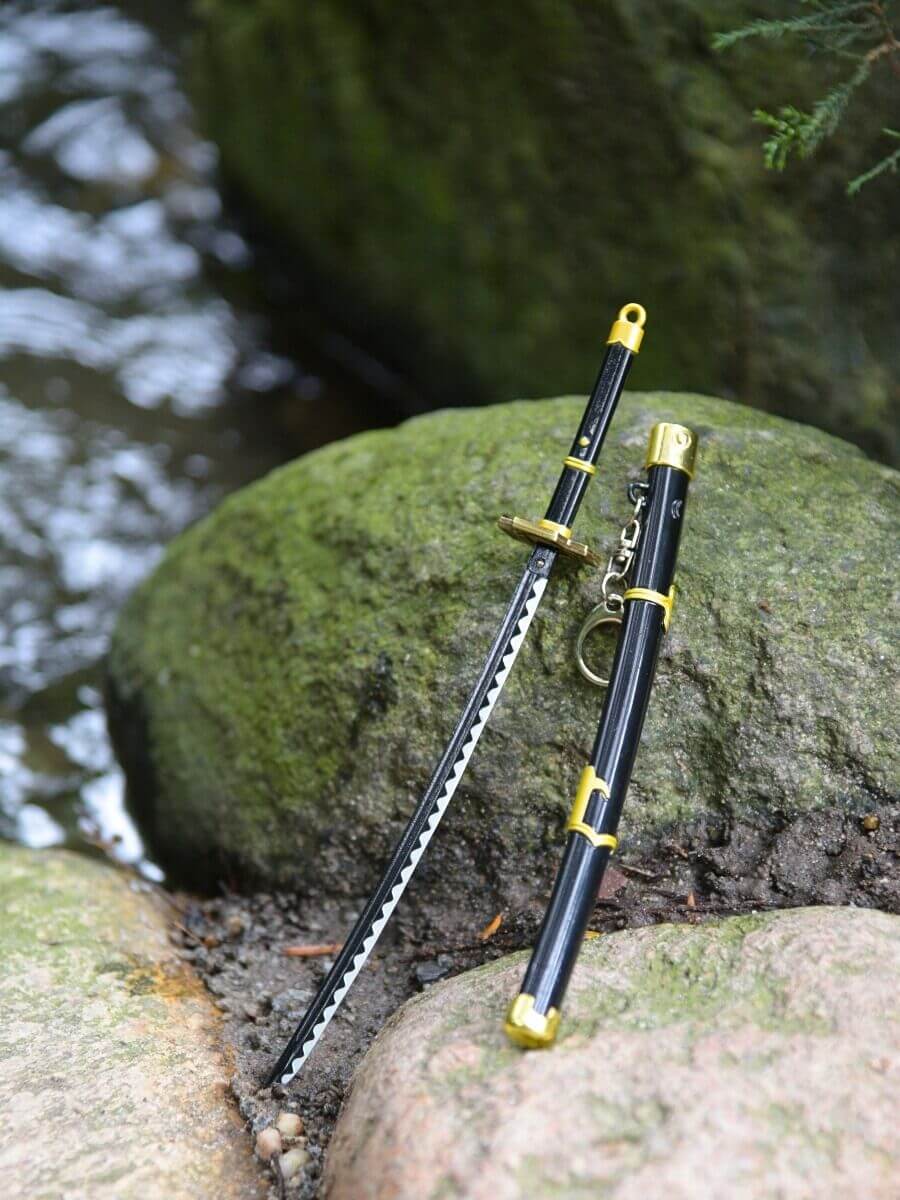 Zoro miniature katana, freed from its sheath, rests peacefully on a rock, surrounded by nature's embrace of water.